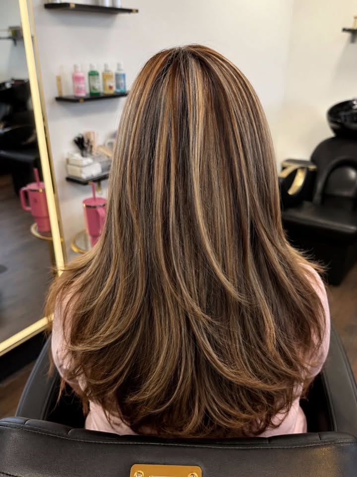 Client with professional balayage hair color at The Vault salon
